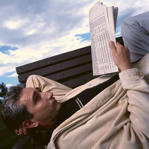 Man reading a newspaper in the great Baguio outdoors